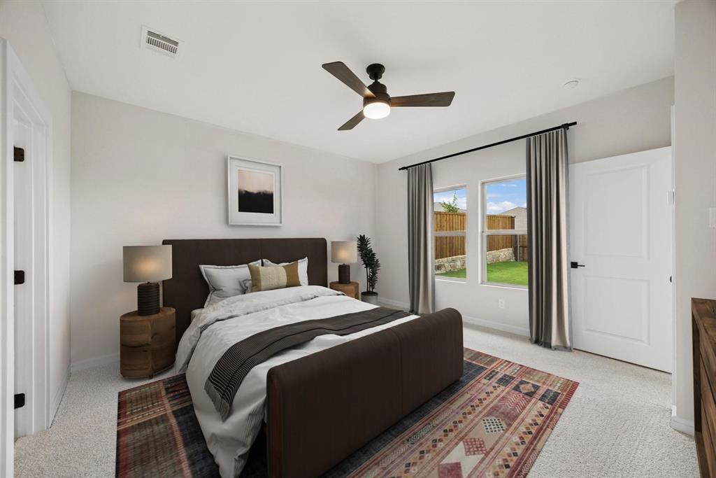 1317 Richardson Street Howe, TX 75459 - Photo 17 of 24 a bed room with a bed and a couch