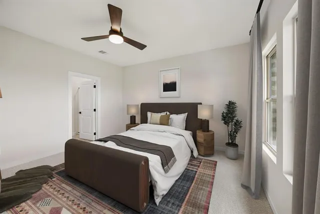 a bedroom with bed and a window