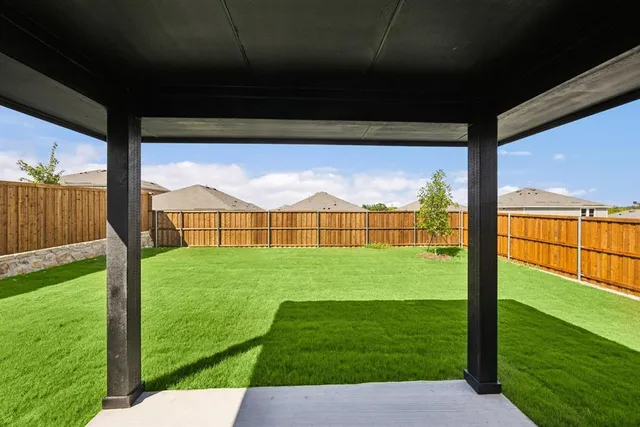 a view of a porch and garden