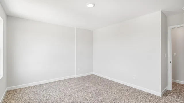 a view of a patio with lawn chairs floor to ceiling window with yard view