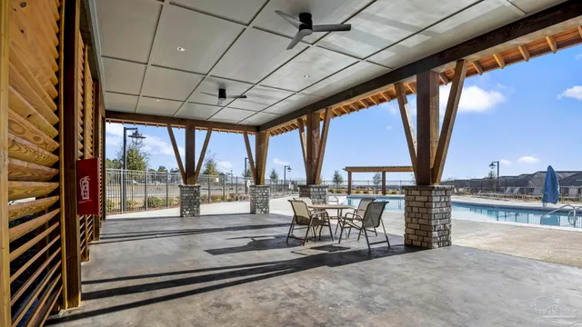 a swimming pool with wooden fence