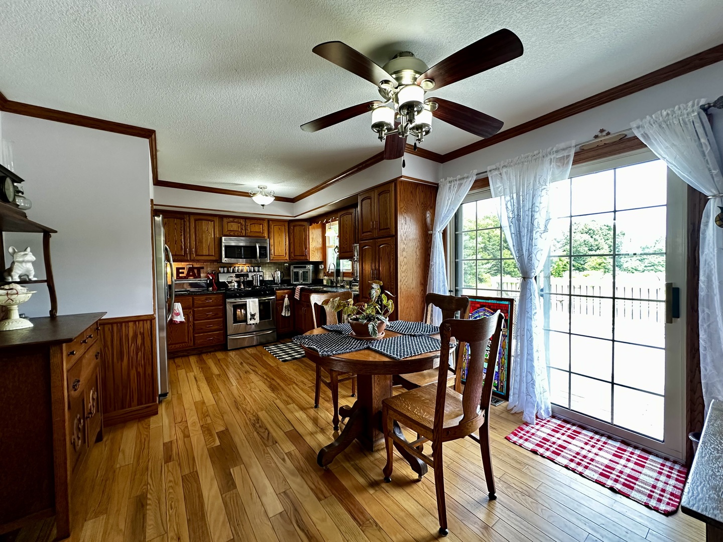 6119 Little Galilee Road Clinton, IL 61727 - Photo 12 of 26 a view of a dining room with furniture window and wooden floor