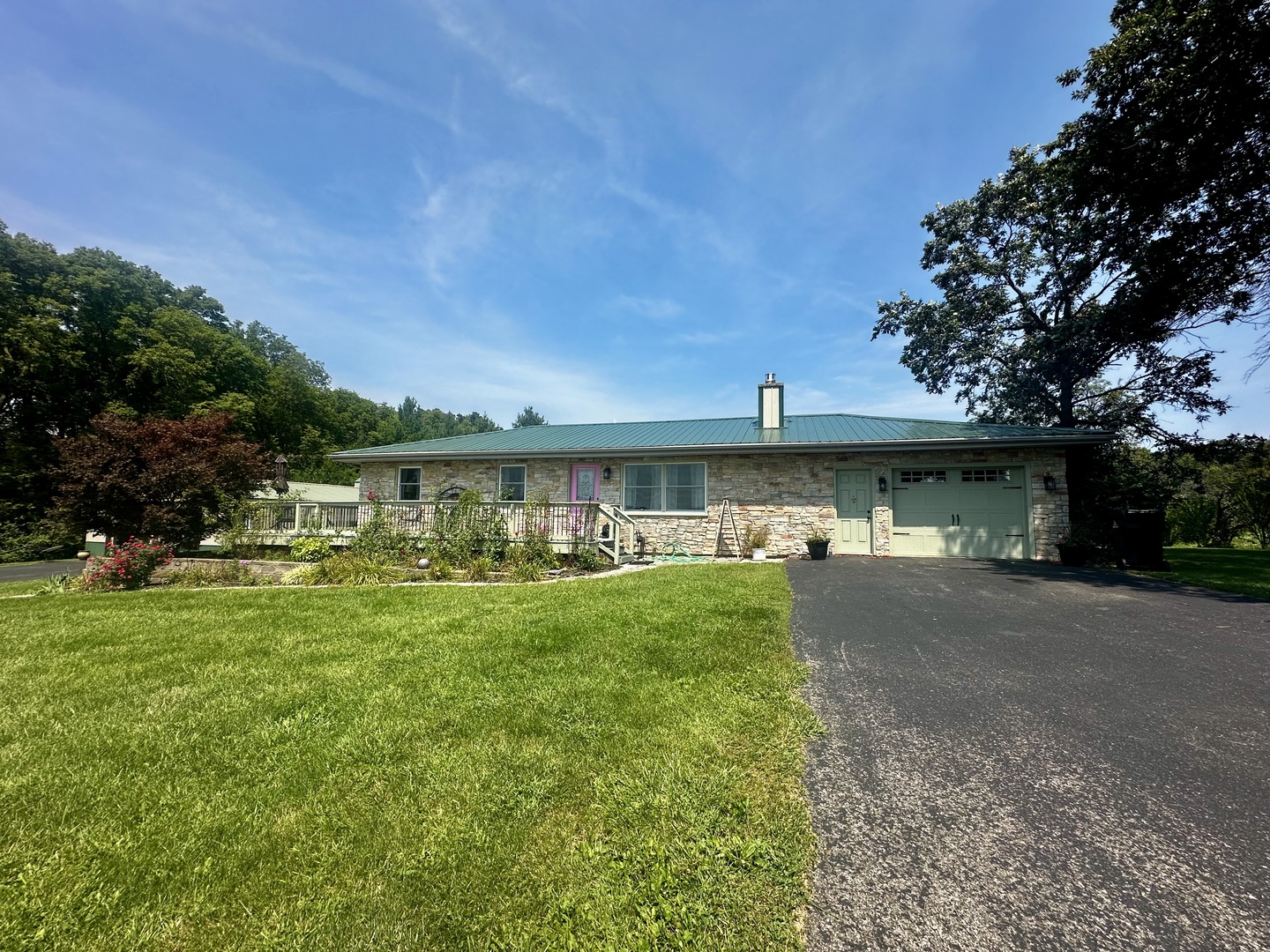 6119 Little Galilee Road Clinton, IL 61727 - Photo 2 of 26 a front view of a house with a garden and porch