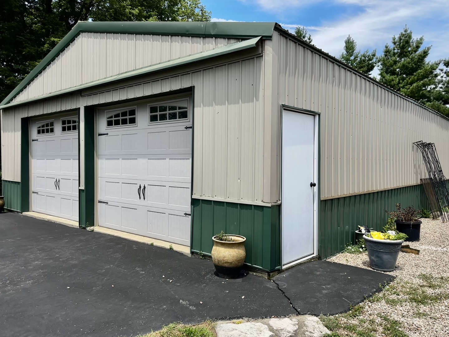 6119 Little Galilee Road Clinton, IL 61727 - Photo 21 of 26 a view of a small house with potted plants