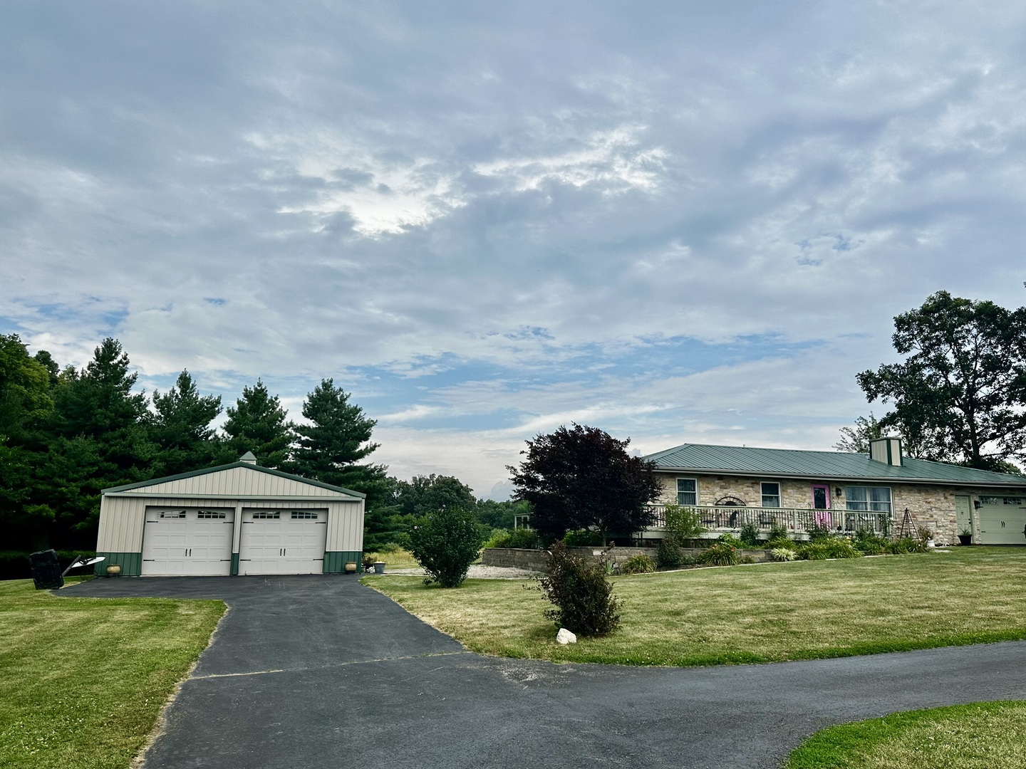 6119 Little Galilee Road Clinton, IL 61727 - Photo 3 of 26 a front view of a house with a yard and garage