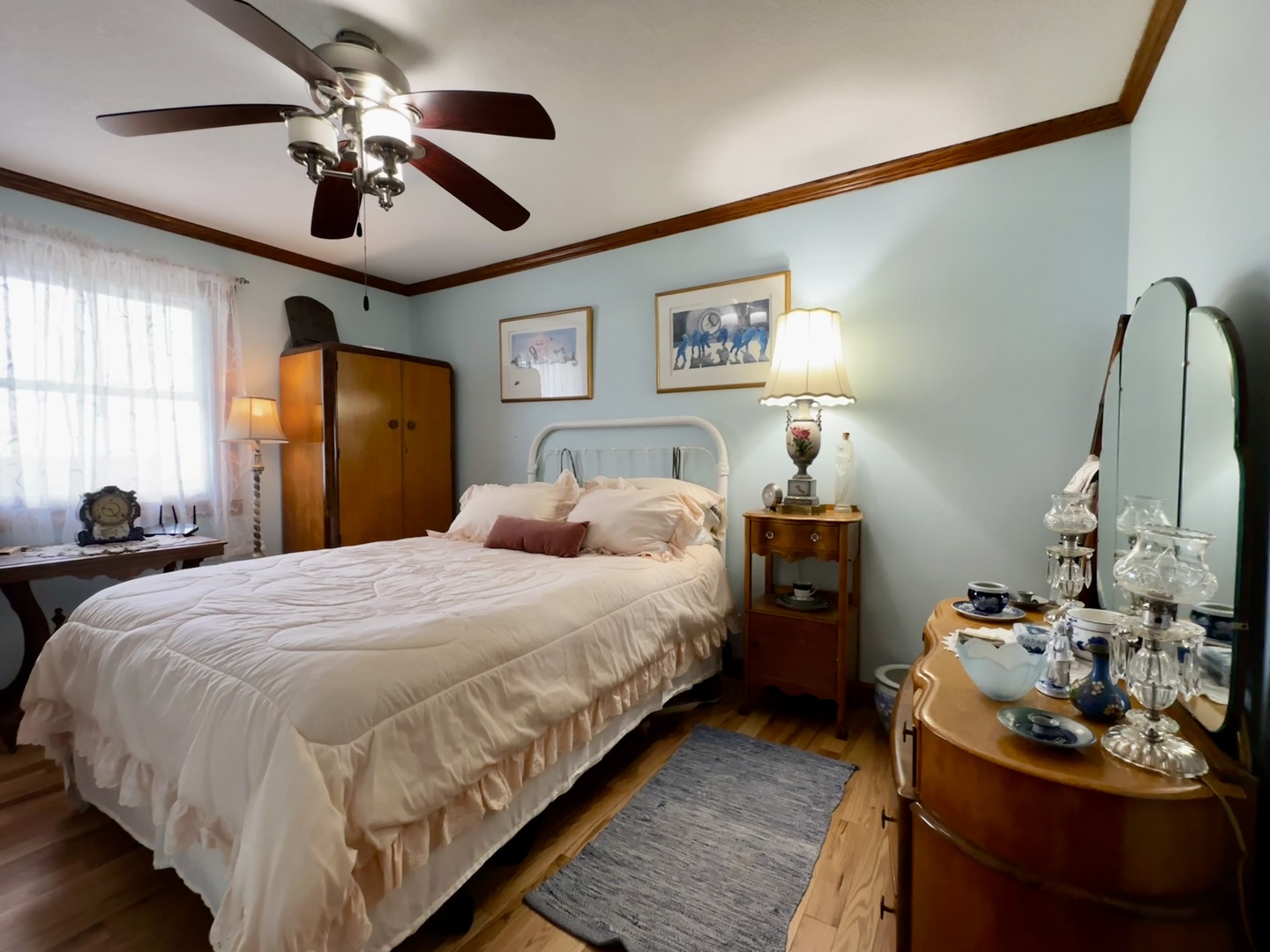 6119 Little Galilee Road Clinton, IL 61727 - Photo 7 of 26 a bedroom with bed and a chandelier