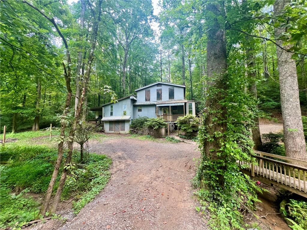 579 Banner Circle Ellijay, GA 30540 - Photo 1 of 13 a front view of a house with garden