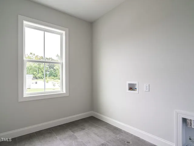 a view of empty room with windows