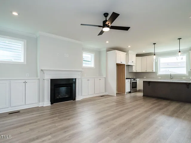 a view of a kitchen with a sink and a refrigerator
