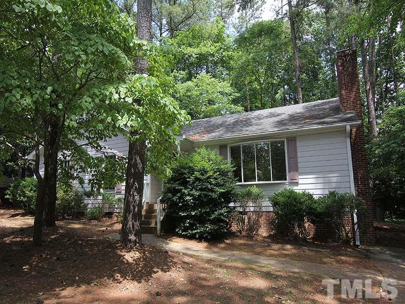 6416 Wynbrook Way Raleigh, NC 27612 - Photo 1 of 13 a view of a house with backyard sitting area and garden