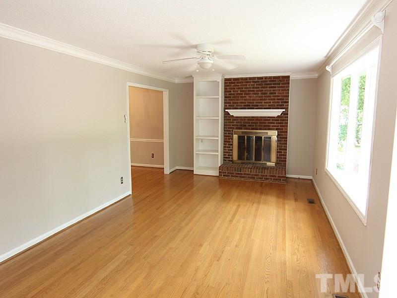 6416 Wynbrook Way Raleigh, NC 27612 - Photo 2 of 13 wooden floor in an empty room with a window