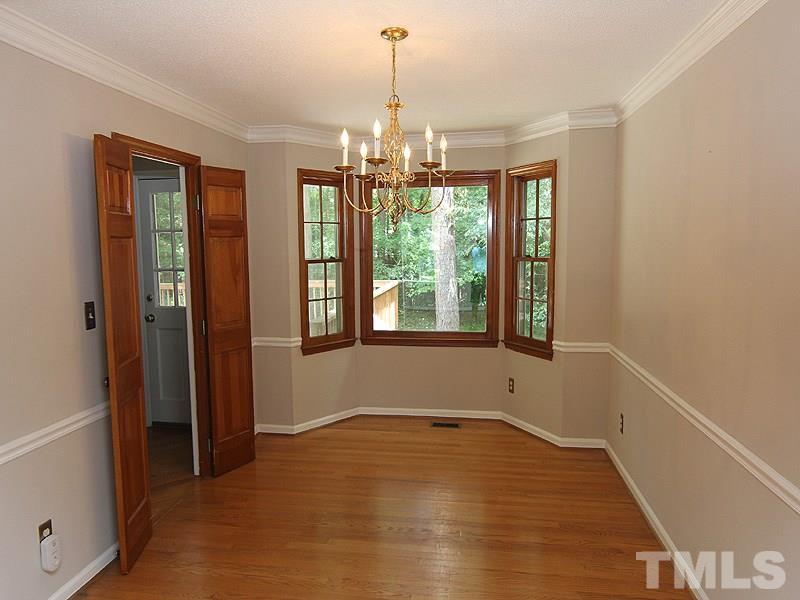 6416 Wynbrook Way Raleigh, NC 27612 - Photo 4 of 13 a view of an empty room with a window