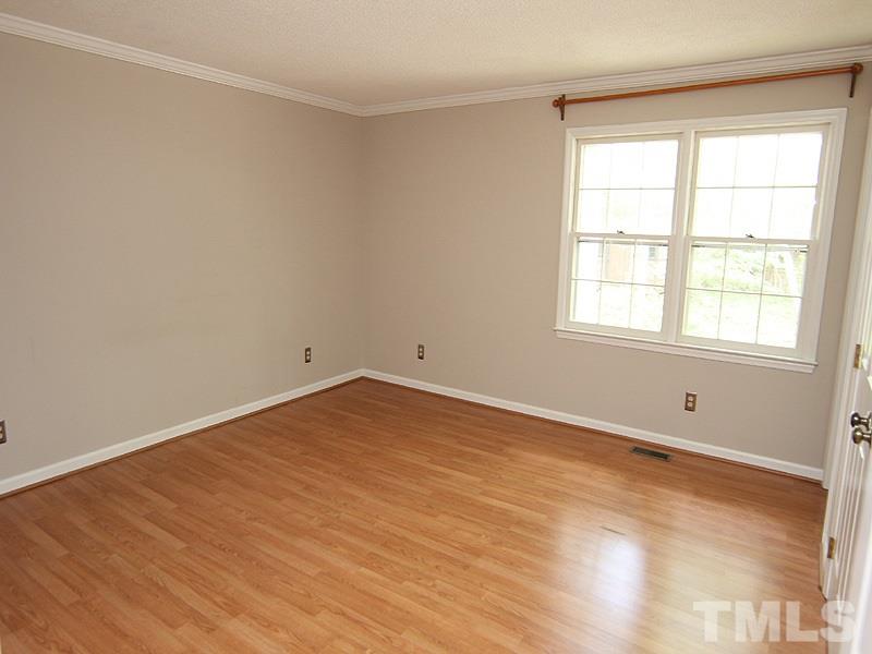6416 Wynbrook Way Raleigh, NC 27612 - Photo 7 of 13 an empty room with a window