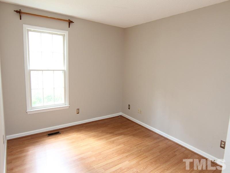 6416 Wynbrook Way Raleigh, NC 27612 - Photo 9 of 13 an empty room with a window