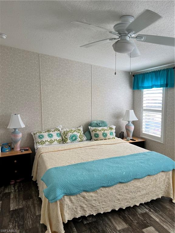 6 Cannes Drive Naples, FL 34112 - Photo 11 of 21 a bedroom with a bed and window