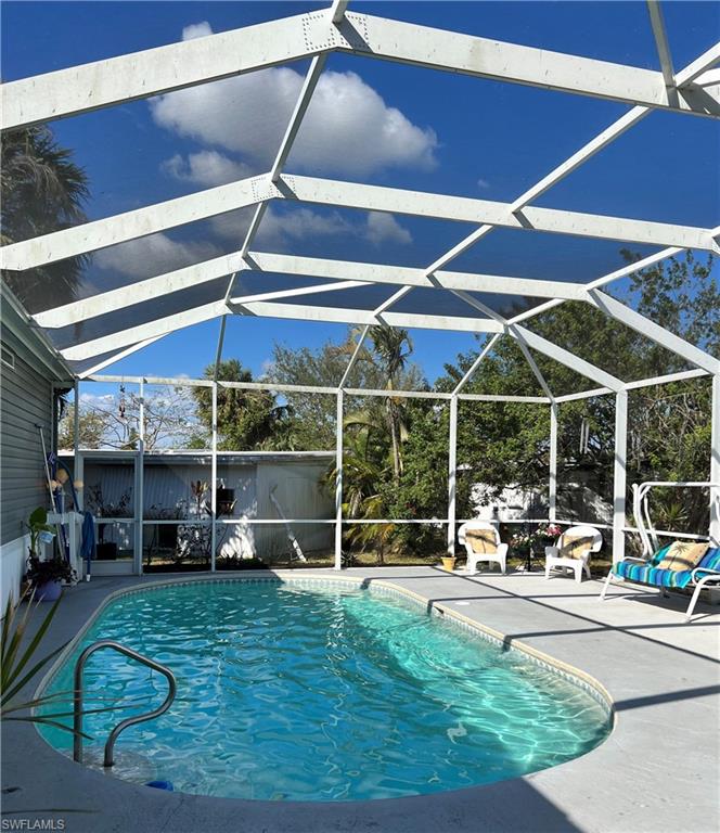 6 Cannes Drive Naples, FL 34112 - Photo 18 of 21 a view of outdoor space with porch