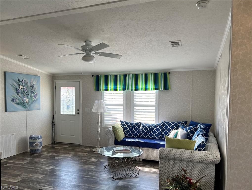 6 Cannes Drive Naples, FL 34112 - Photo 5 of 21 a living room with furniture and window