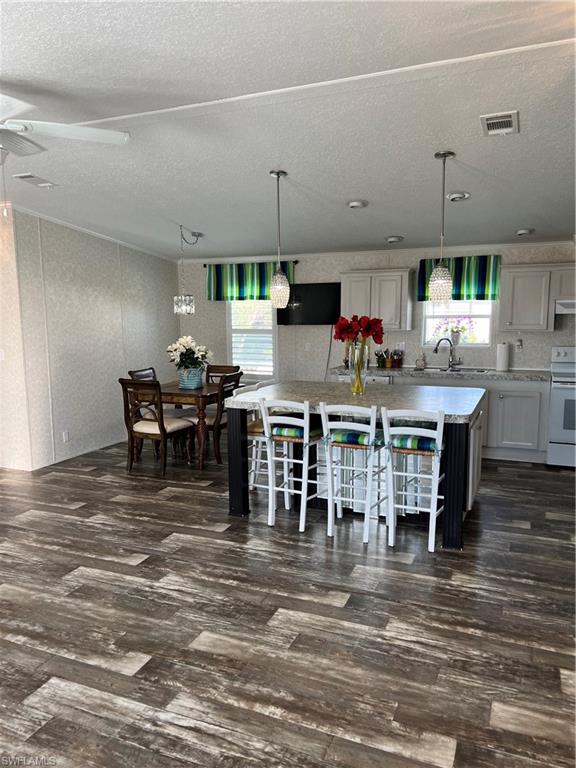 6 Cannes Drive Naples, FL 34112 - Photo 7 of 21 a view of a dining room with furniture