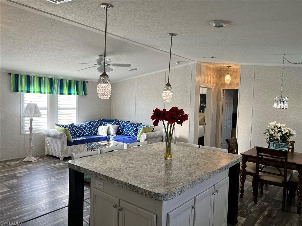 6 Cannes Drive Naples, FL 34112 - Photo 8 of 21 a view of a dining hall with a table and chairs