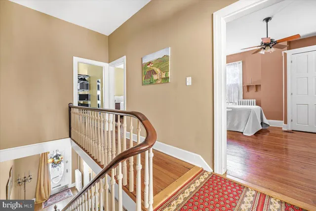 a view of an entryway with wooden floor