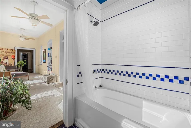 a bathroom with a bathtub and a shower
