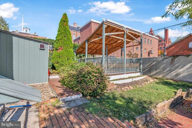 a view of a balcony with wooden floor