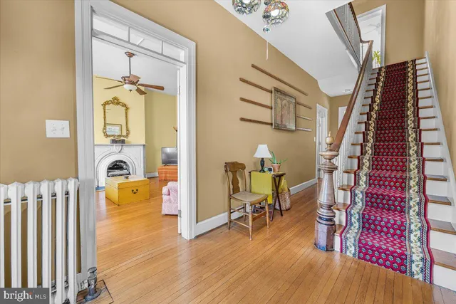 a view of an entryway with wooden floor and windows