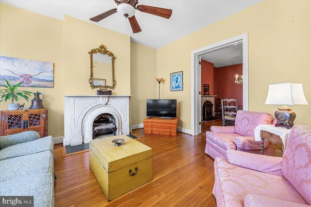 a living room with furniture and a fireplace