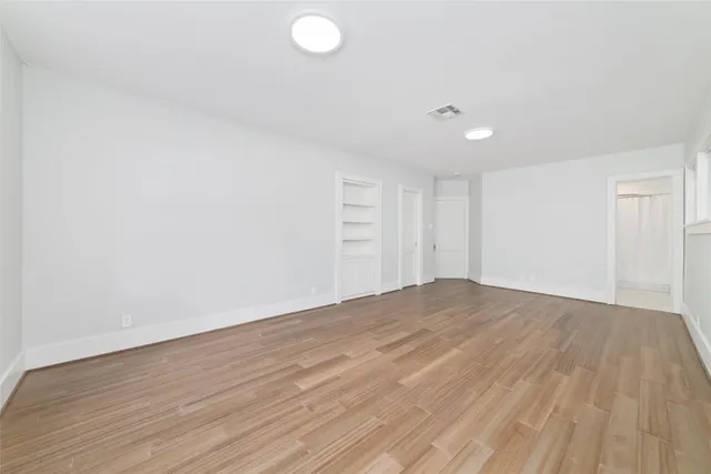 a bathroom with a toilet a sink and a mirror