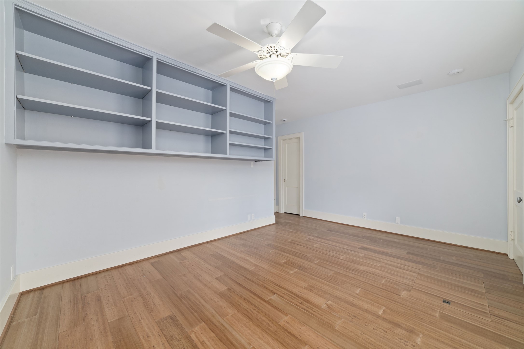 2907 Albany Street Houston, TX 77006 - Photo 22 of 29 a view of an empty room with a fan and a window