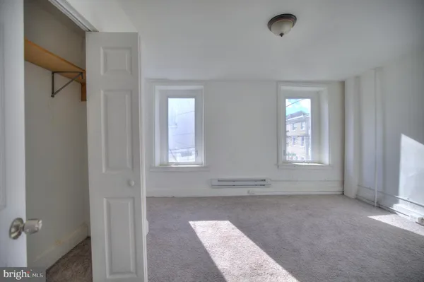 an empty room with windows
