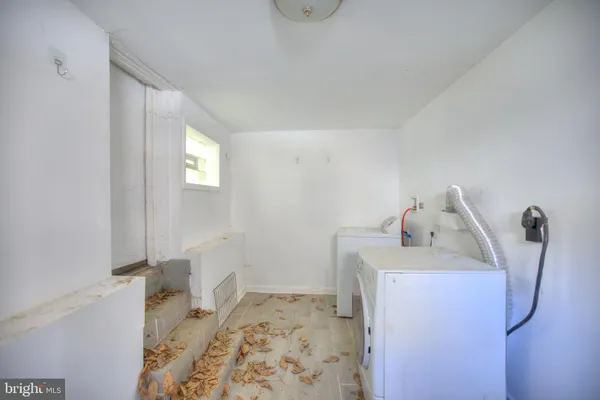a bathroom with a bathtub sink and mirror