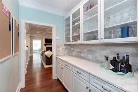 a kitchen with a refrigerator and a sink