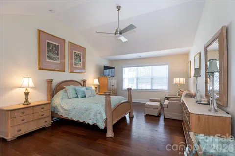 a bedroom with furniture and window