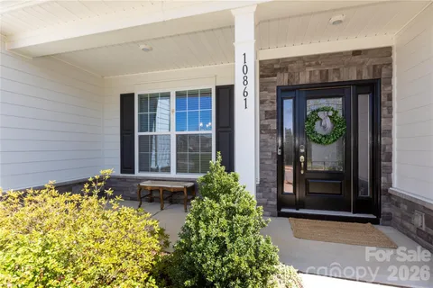 front view of a brick house with a large windows