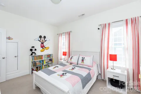 a bedroom with a bed and a closet