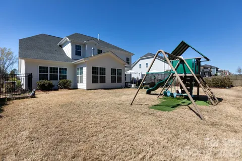 a house with trees in the background