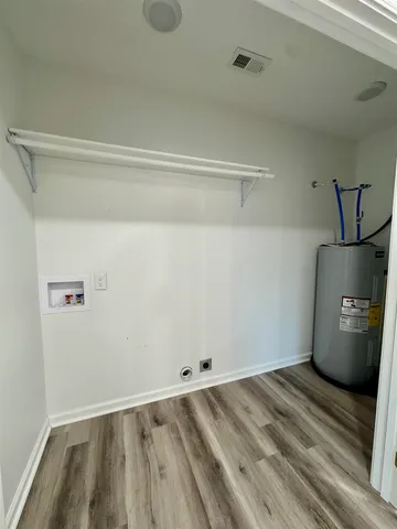 a view of storage and utility room with empty racks