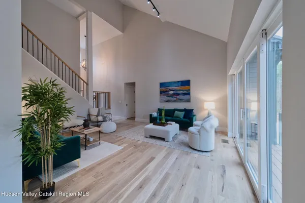 a living room with furniture and a rug