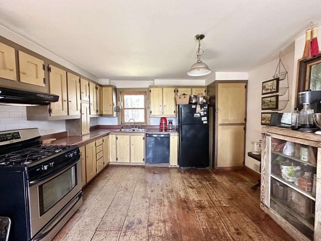 200 Scott Road Worthington, MA 01098 - Photo 8 of 42 a kitchen with stainless steel appliances granite countertop a refrigerator stove top oven and sink