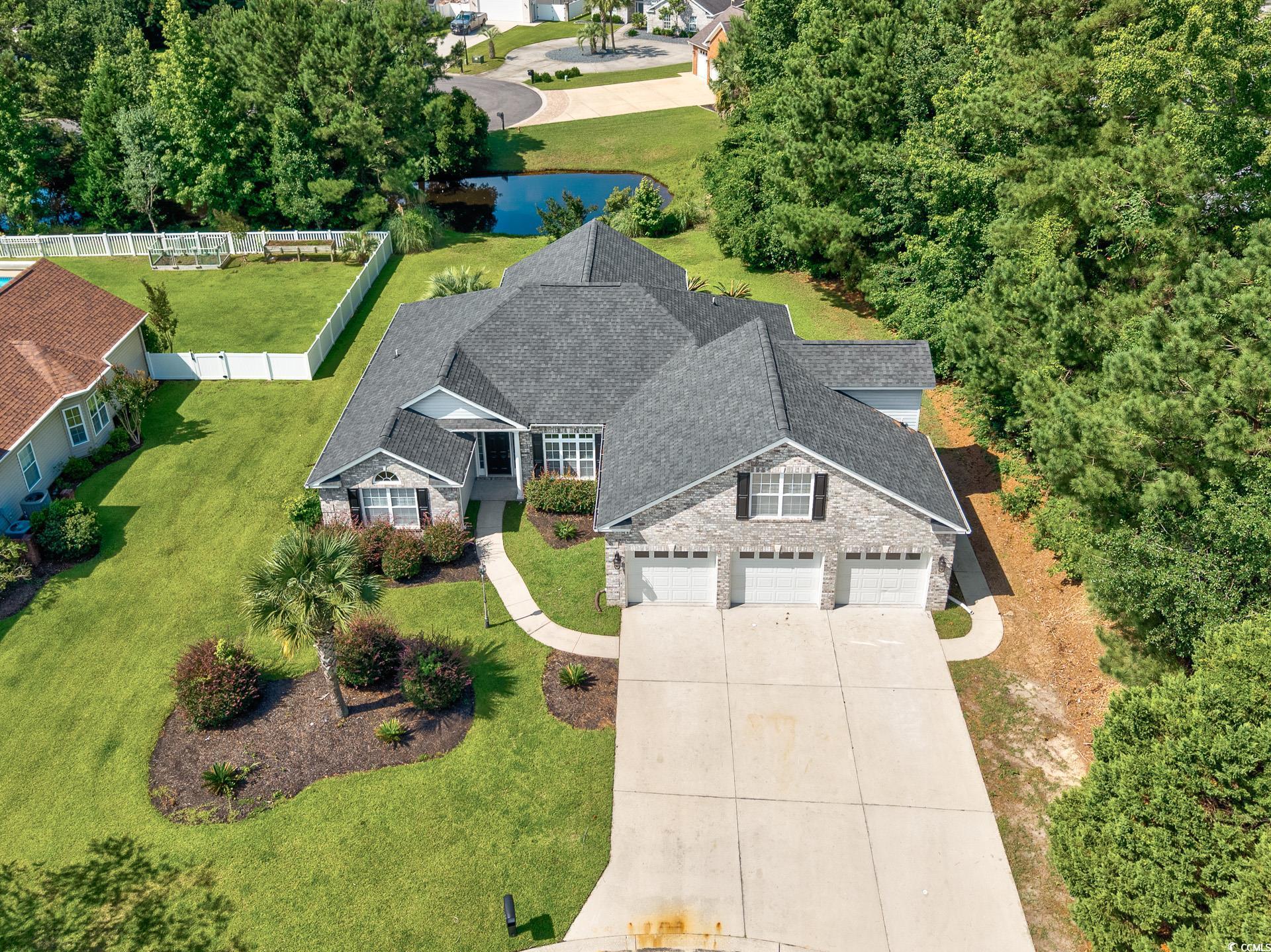 229 Duchess Court Myrtle Beach, SC 29588 - Photo 2 of 40 View of front of house with fence, stone siding, c