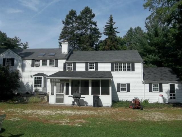 441 Rock Rimmon Road Stamford, CT 06903 - Photo 1 of 1 a house that has a big yard in front of it