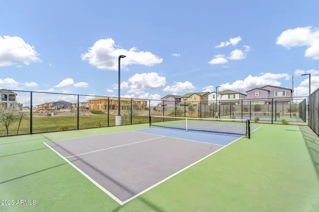 a view of an outdoor space and basketball court
