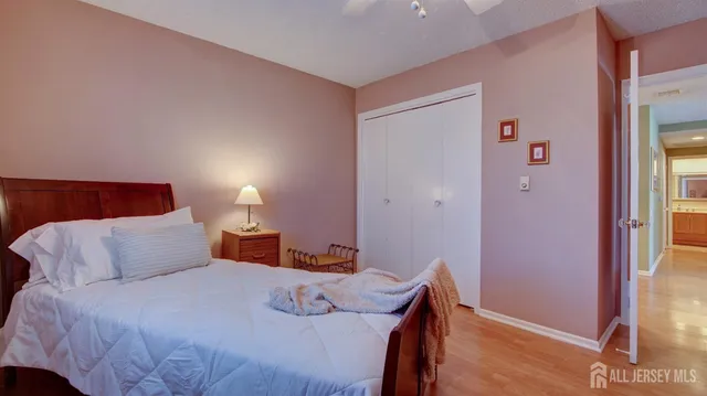 a bedroom with a bed and a lamp