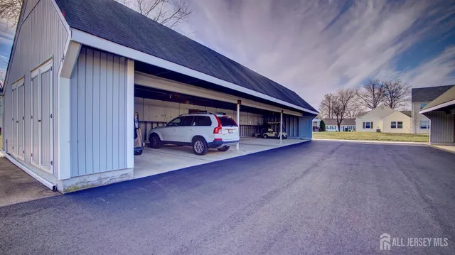 a view of a car park in front of house