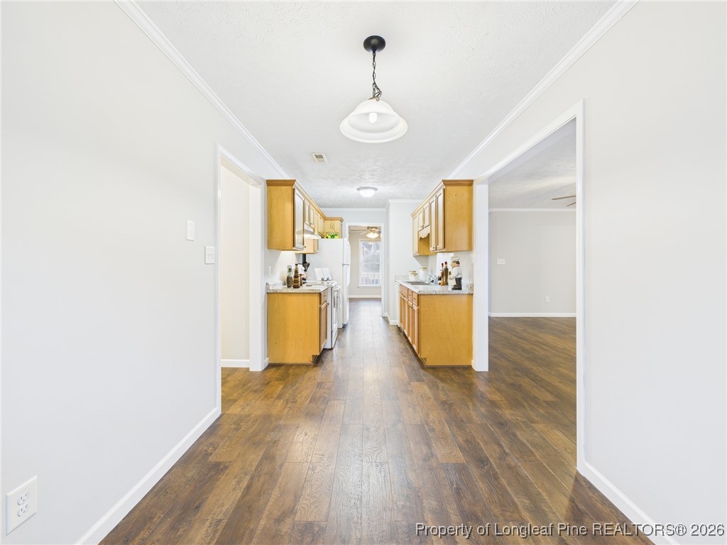 4403 Bishamon Street Hope Mills, NC 28348 - Photo 12 of 41 a view of a kitchen with wooden floor