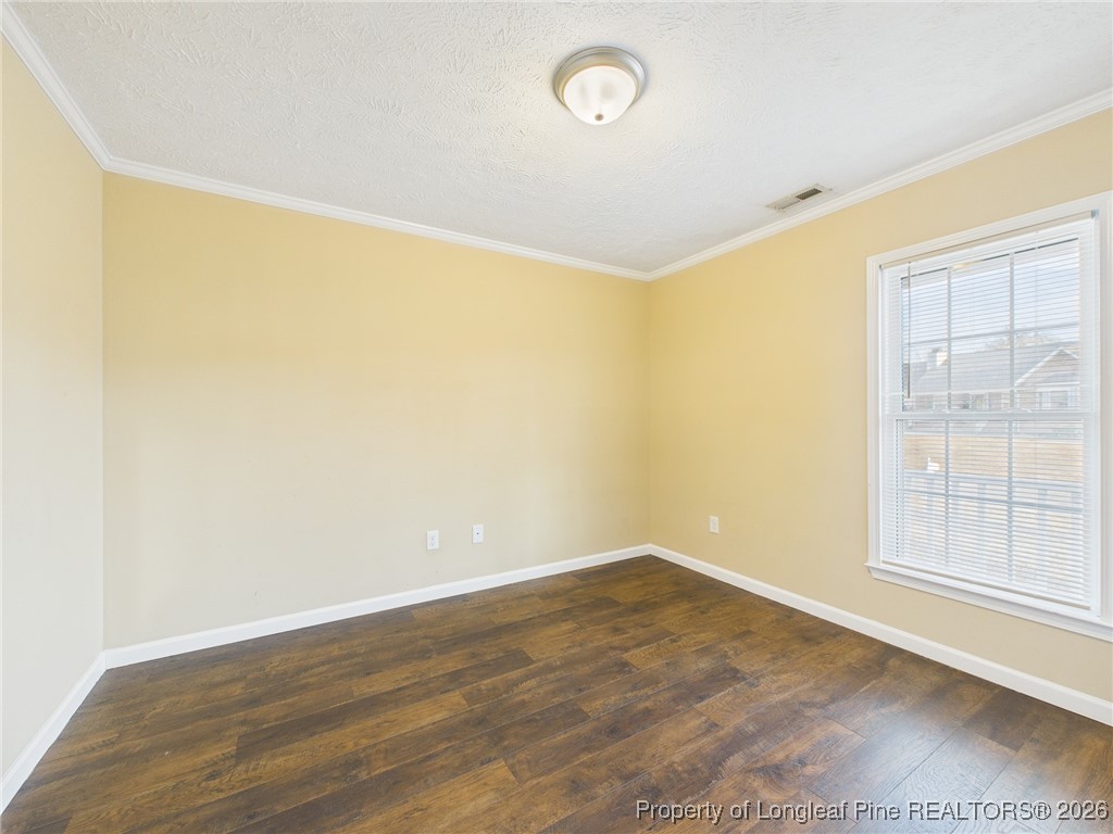 4403 Bishamon Street Hope Mills, NC 28348 - Photo 26 of 41 an empty room with wooden floor and windows