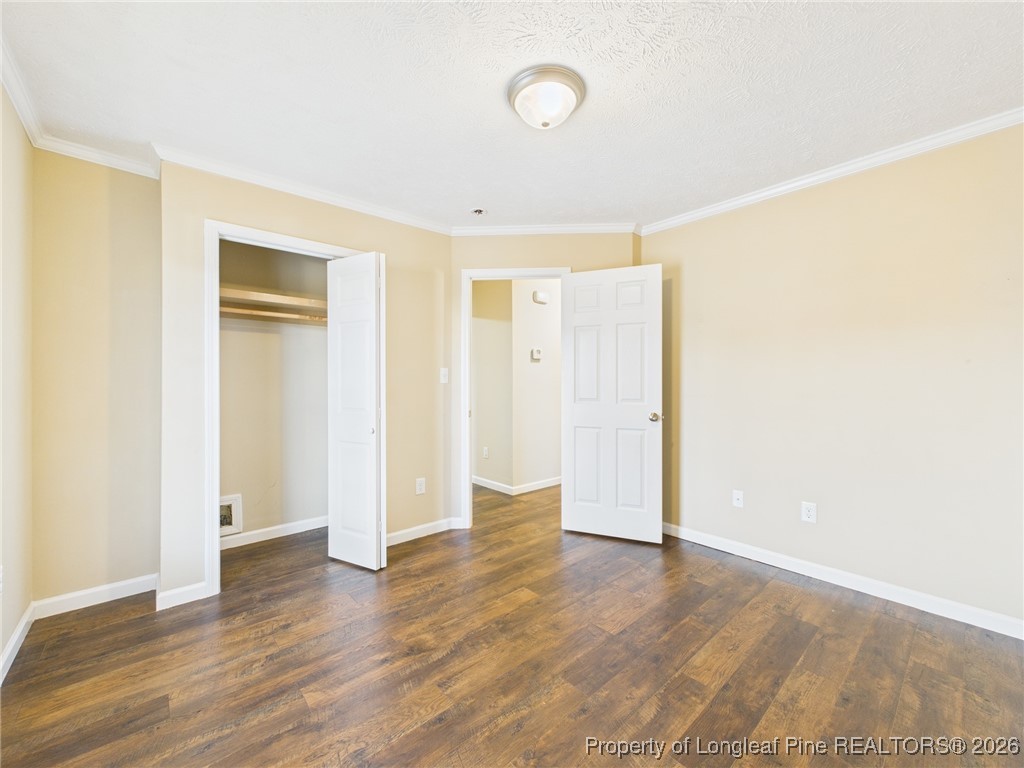 4403 Bishamon Street Hope Mills, NC 28348 - Photo 28 of 41 a view of an empty room with wooden floor and closet