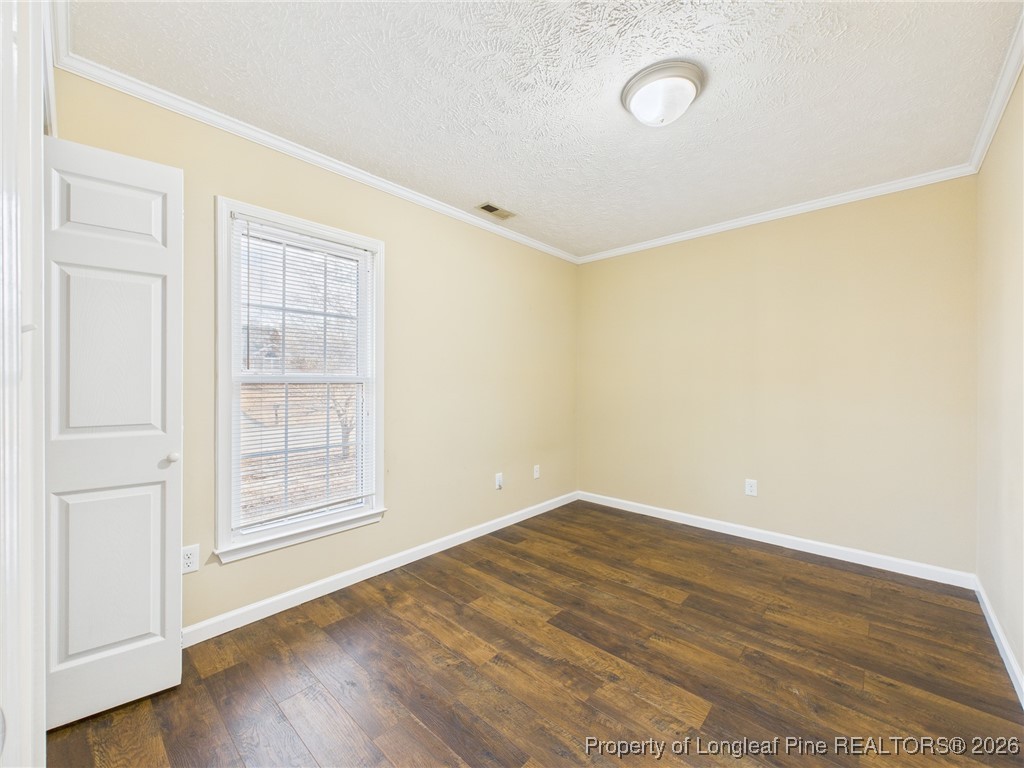 4403 Bishamon Street Hope Mills, NC 28348 - Photo 32 of 41 an empty room with wooden floor and windows