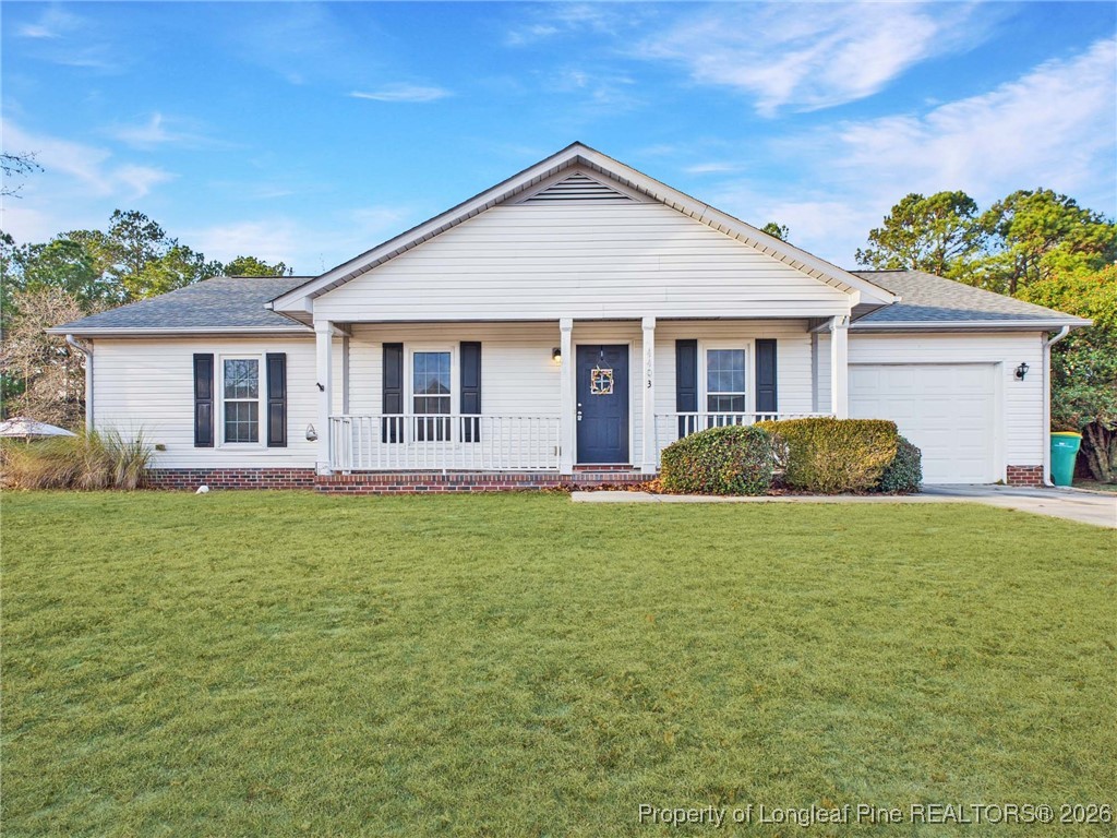 4403 Bishamon Street Hope Mills, NC 28348 - Photo 37 of 41 a front view of house with yard and green space